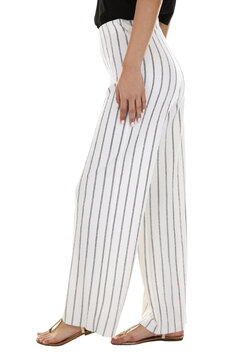 Woman wearing pants in a white studio for e-commerce fashion