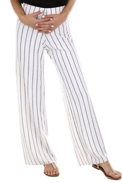 Woman wearing pants in a white studio for e-commerce fashion