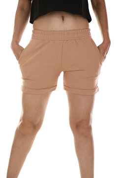 Woman wearing shorts in a white studio for e-commerce fashion