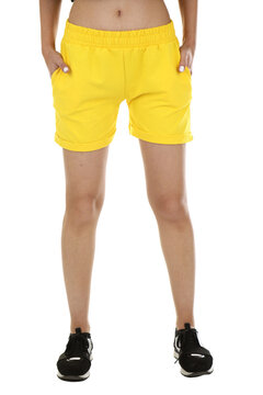 Woman wearing shorts in a white studio for e-commerce fashion