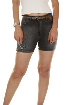 Woman wearing shorts in a white studio for e-commerce fashion