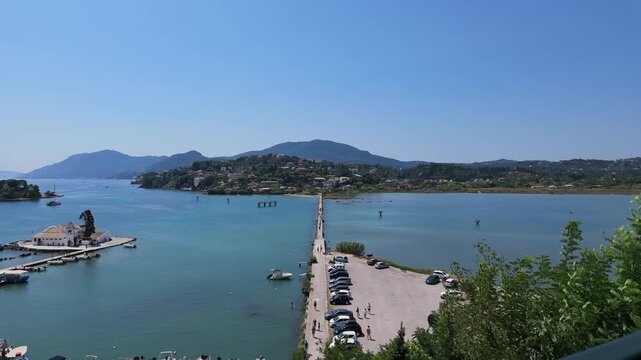 4K Timelapse capturing movement along planespotting causeway with boat passing near Corfu Airport, Greece