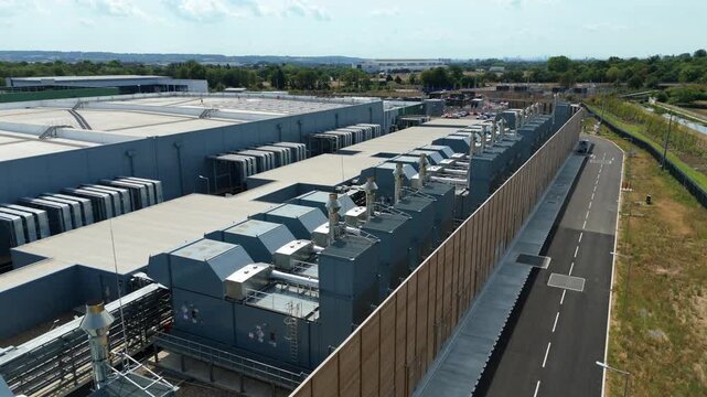 Aerial view of hyperscale data center with external cooling units and server room chillers in Waltham Cross, England, United Kingdom.