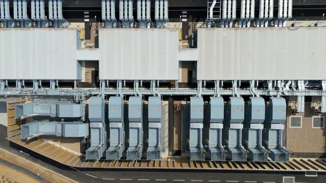 Aerial view of hyperscale data center with rows of external cooling units and server room chillers in Waltham Cross, England, United Kingdom.