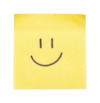 Yellow Sticky Note With Hand-Drawn Smiley Face Symbol
