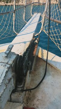 Anchor Chain Descending From Yacht Into Sea