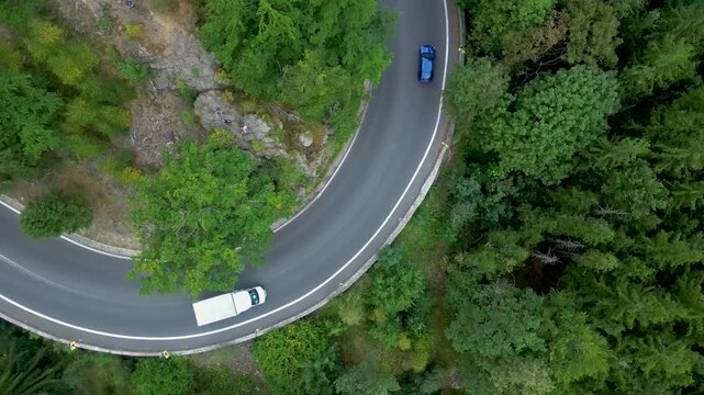 Top down aerial view of cars maneuvering serpentine mountain curve Szklarska Poręba Poland Zakręt Śmierci