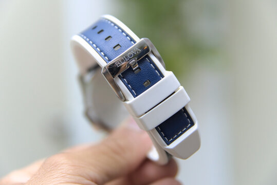 ZAPOPAN, MEXICO - AUGUST 25, 2026: Hand holding a Bulova Marine Star watch strap buckle.