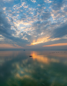Hefei Chaohu Zhongmiao Sunset Tyndall Light Aerial Photo: Golden Rays Pierce Clouds Over Calm Waters with Solitary Boats at Dusk