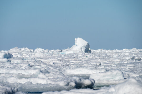 Icebergs floating at the edge of the sea ice above Svalbard, Norway