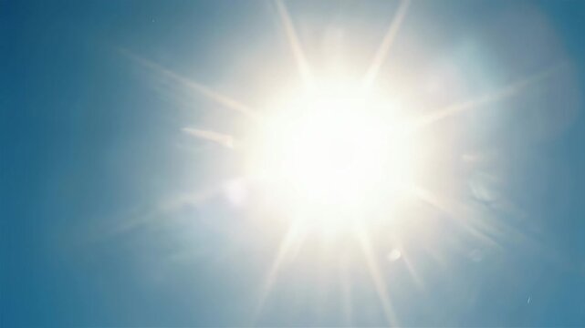 じりじりと猛暑の日。青空に輝く眩しい太陽とレンズフレア