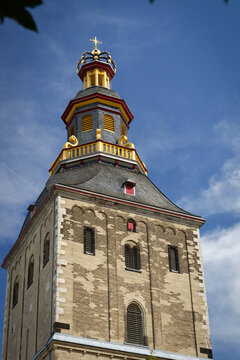 The distinctive tower of St. Ursula Basilica in Cologne in late August. Romanesque architecture with a baroque crown top under a blue sky