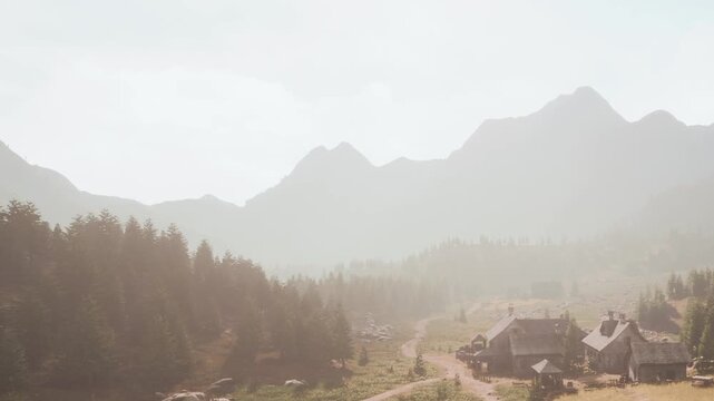 A view of a rural area featuring simple houses along a winding path. Mountains rise in the background. Trees surround the area. It is daytime with a clear sky.