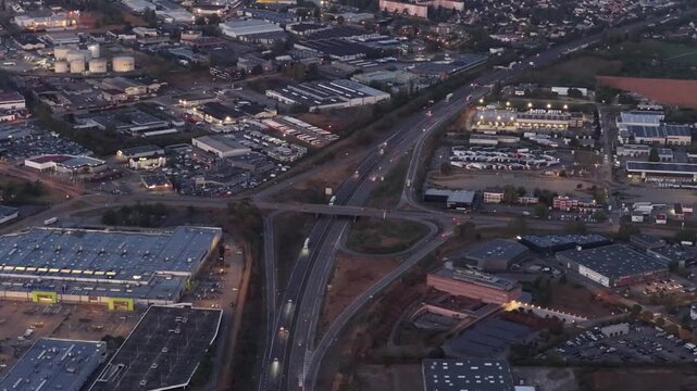 Aerial view of the highway interchange and surrounding industrial buildings in Sausheim, Grand Est, France.