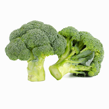 Fresh, vibrant green heads of raw broccoli placed side by side, highlighting their detailed leafy textures.
