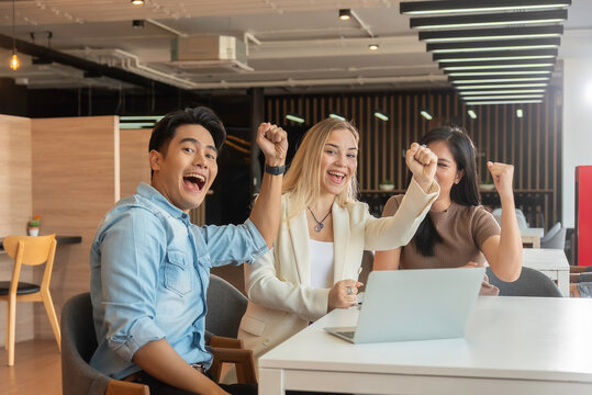 Group of powerful diversity creative people high five on air to greeting power of team. Multiethnic businesspeople working together. Collaboration in Business Team success. StrongTeamwork concept.