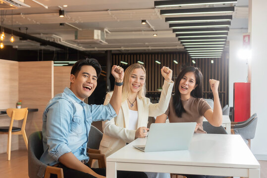Group of powerful diversity creative people high five on air to greeting power of team. Multiethnic businesspeople working together. Collaboration in Business Team success. StrongTeamwork concept.