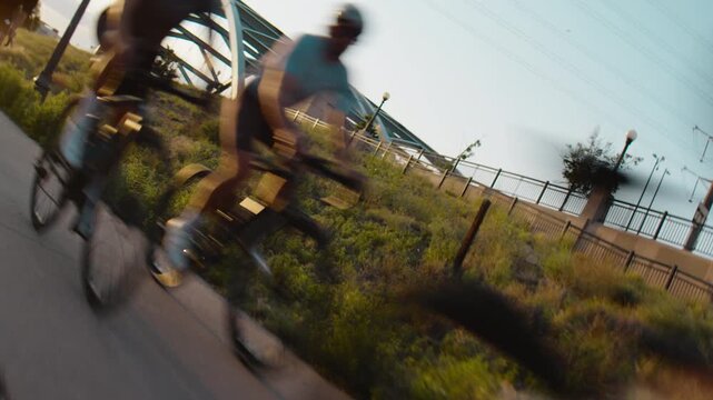 Bikes zooming past the camera on a group bike ride in Denver Colorado at Sunset