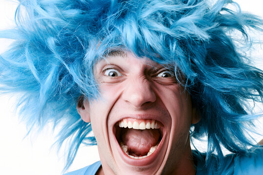 crazy, funny, young man with a blue wig