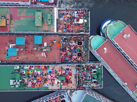 Dhaka, Bangladesh - 25 August 2026: Aerial view of crowded ferry decks filled with passengers traveling home for Eid celebrations.