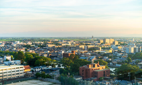 Aerial view of Saga cityscape and skyline at golden hour sunset, Japan