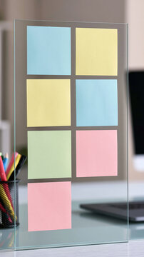 Glass Memo Board with Sticky Notes: A clear glass memo board is adorned with six colorful sticky notes in a grid arrangement, offering a neat and organized way to jot down ideas and reminders.