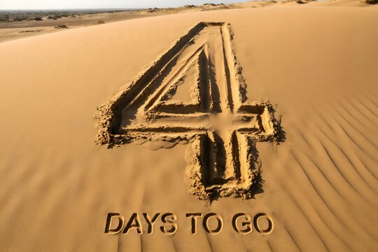 Number 4 written in desert sand with text days to go for countdown and deadline concepts