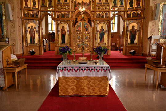 Interior of a traditional Ukrainian church with decorated altar and iconostasis