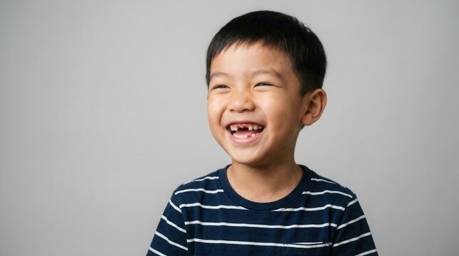 A joyful child with a wide smile reveals a gap from a missing upper tooth.