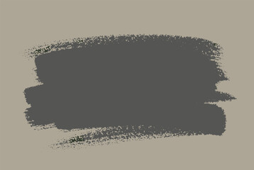 Fototapeta premium Thick horizontal charcoal gray paint brush stroke with rough edges centered on a neutral taupe colored paper background.