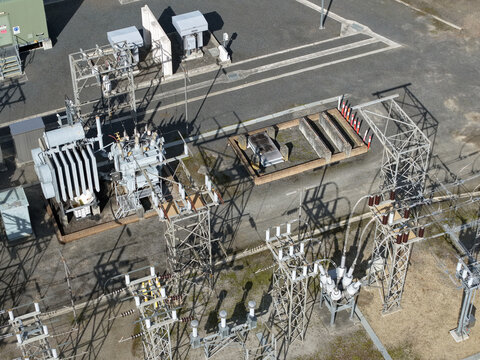 Ferntree Gully, Australia - 24 August 2026: Aerial view of Ferntree Gully Zone Substation with electrical transformers, high-voltage equipment, metal structures, and concrete foundations.