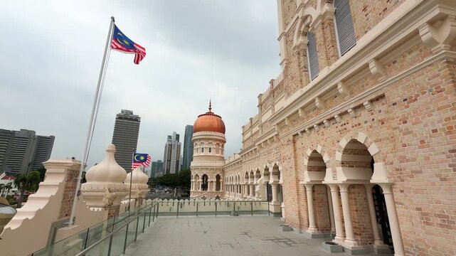 Sultan Abdul Samad Building balcony with Malaysian Flags and City Skyline