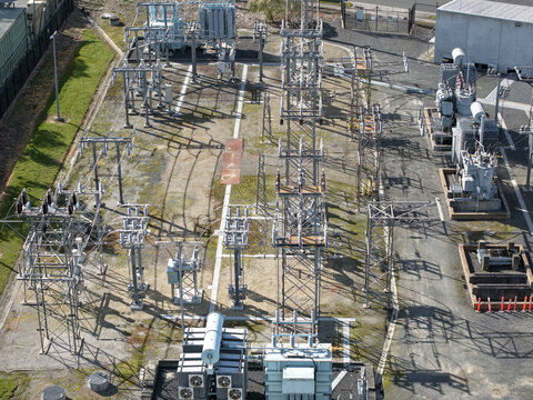 Ferntree Gully, Australia - 24 August 2026: Aerial view of Ferntree Gully Zone Substation featuring electrical transformers, steel transmission towers, and gravel ground.