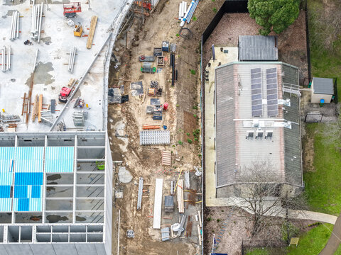 Croydon, Australia - 24 August 2026: Aerial view of construction site with building materials and equipment.