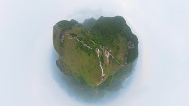 Drone view landscape of zigzag step footpath to top of green mountains in Fengtang village, Hechi, Guangxi, China, 4k real time footage travel concept b roll shot high angle view.