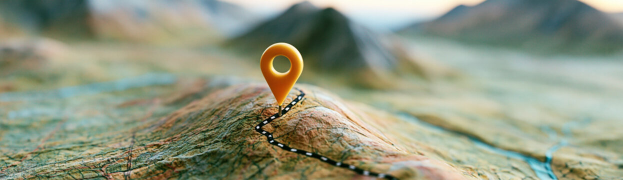A close-up of a topographic map with a red location pin marking a specific mountainous area.