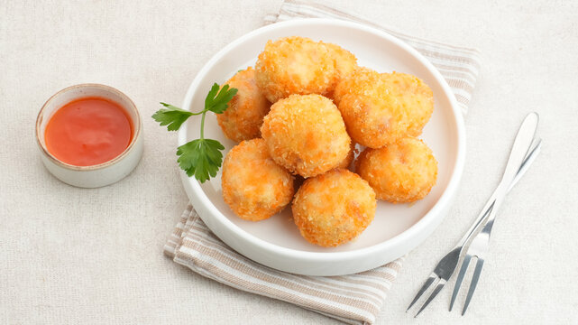 Crispy Fried Chicken Cordon Bleu Bites on a White Plate
