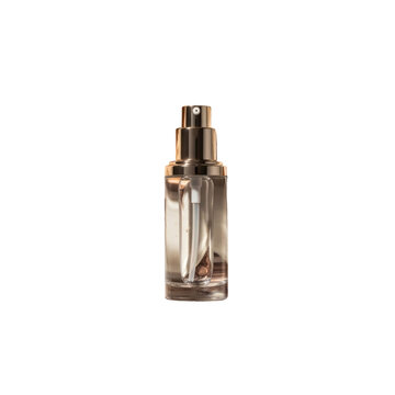 Luxury cosmetic liquid foundation or facial serum in a gold pump bottle on a transparent background