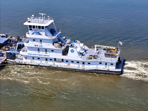 Savanna, Illinois August 19, 2026 The Big J.O. tugboat navigating South down the Mississippi river pushing a set of liquid cargo barges