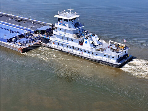 Savanna, Illinois August 19, 2026 The Big J.O. tugboat navigating South down the Mississippi river pushing a set of liquid cargo barges