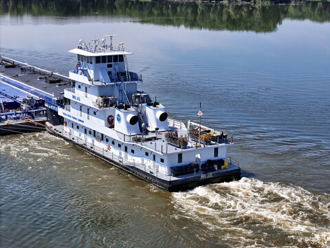 Savanna, Illinois August 19, 2026 The Big J.O. tugboat navigating South down the Mississippi river pushing a set of liquid cargo barges