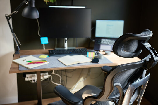 Modern home office desk with ergonomic chair and computer