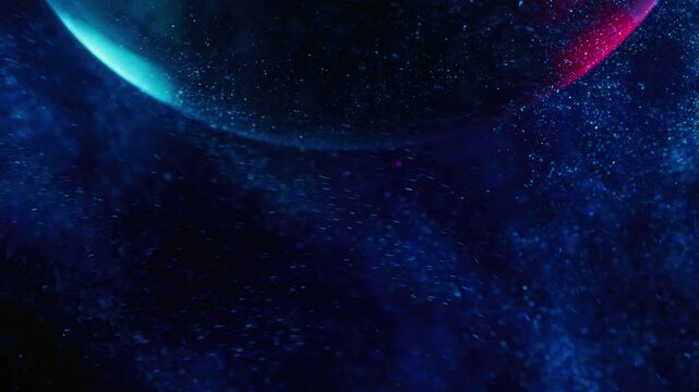 Geometric glitter. Shiny paint. Defocused blue purple neon color mist water round wet texture moving on abstract creative light background.