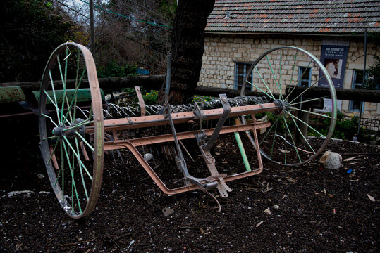 An antique threshing machine kept as an example of early farming machinery