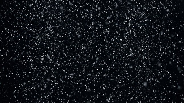 White particles falling on black