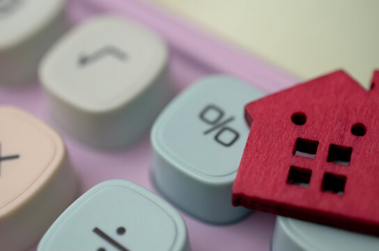 Home Loan and Mortgage Rate Calculation with House on Calculator