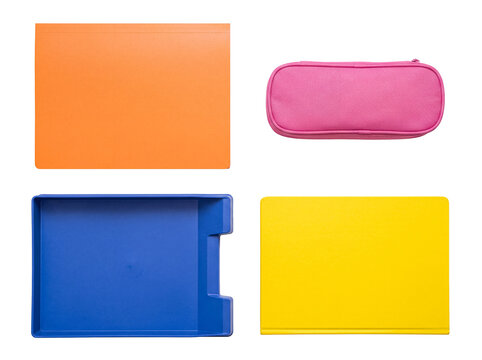Colorful school and office supplies photograph featuring a folder, pencil case, desk tray, and notebook. Isolated.