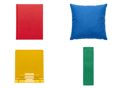 Assortment of colorful household and office items, including a book, pillow, book stand, and fabric.