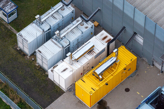 Aerial view of backup diesel generators housed in industrial container units for a data center facility in Poland.