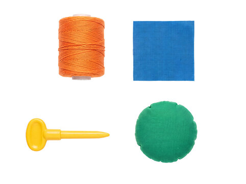 Vibrant collection of sewing and crafting tools: orange thread, blue fabric, yellow awl, green pin cushion.